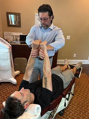 Chiropractor Southern Pines NC Thomas McKay Jr. With Arm Pain Patient HP Chiropractor Thomas McKay Jr. With Arm Pain Patient